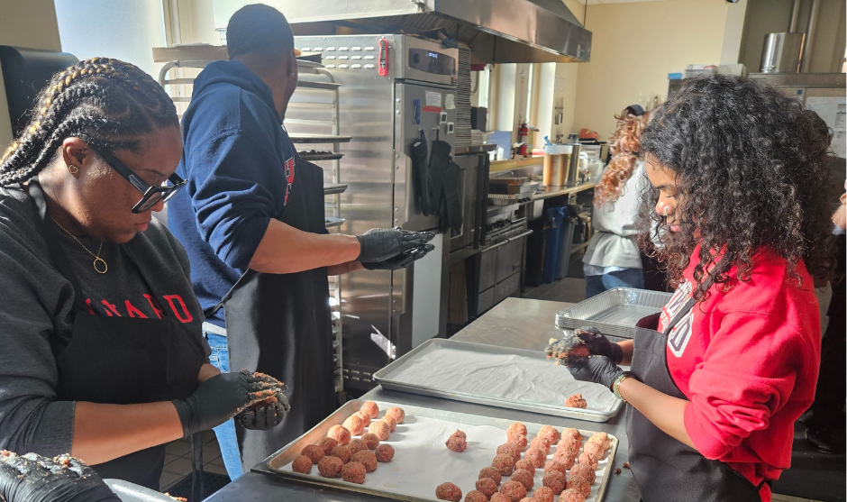 Students serving at food site