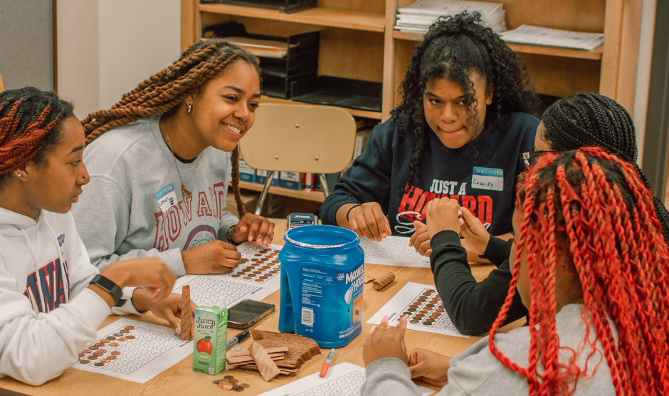 HUASB students tutoring in a class room. 