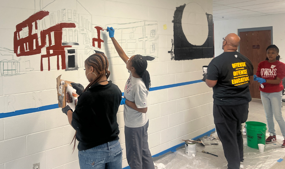 HUASB students painting. 