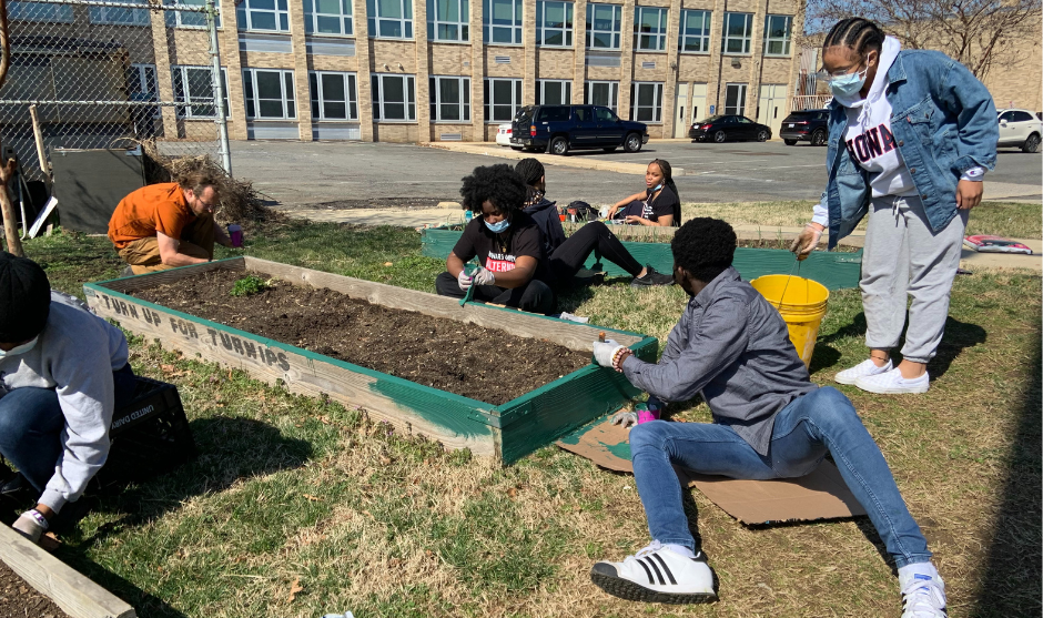 HUASB students working in urban garden.