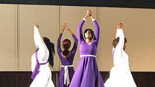 Image of dancers in auditorium posing